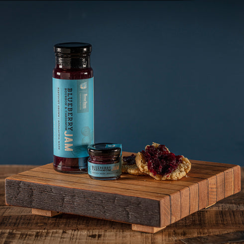 Bourbon Barrel Foods Blueberry Cardamom Bourbon Jam sizes with biscuit spread.