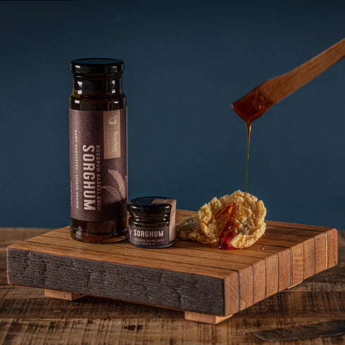 Bourbon Barrel Foods Bourbon Barrel Aged Sorghum Jam Sizes with biscuit spread.