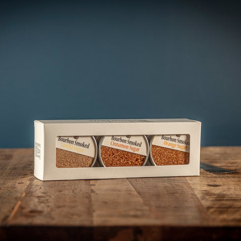 Bourbon Barrel Foods Bourbon Smoked Sugars Gift Set Sugars on a table ready to open.