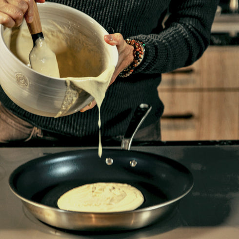 Bourbon Barrel Foods Buttermilk Pancake Mix | Making pancakes by putting batter in the pan.