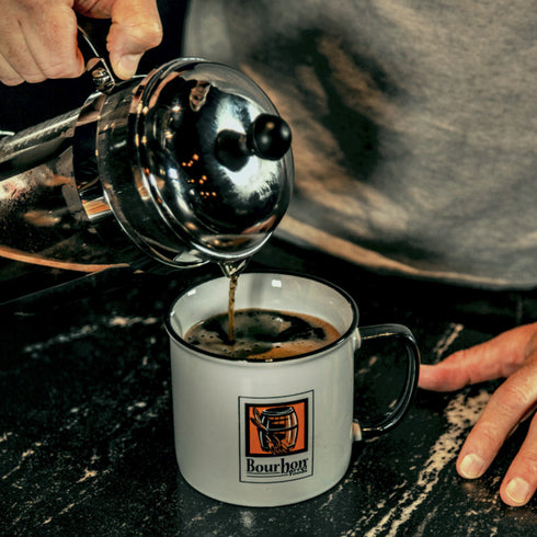 Bourbon Barrel Foods pouring Bourbon Barrel Aged Coffee.