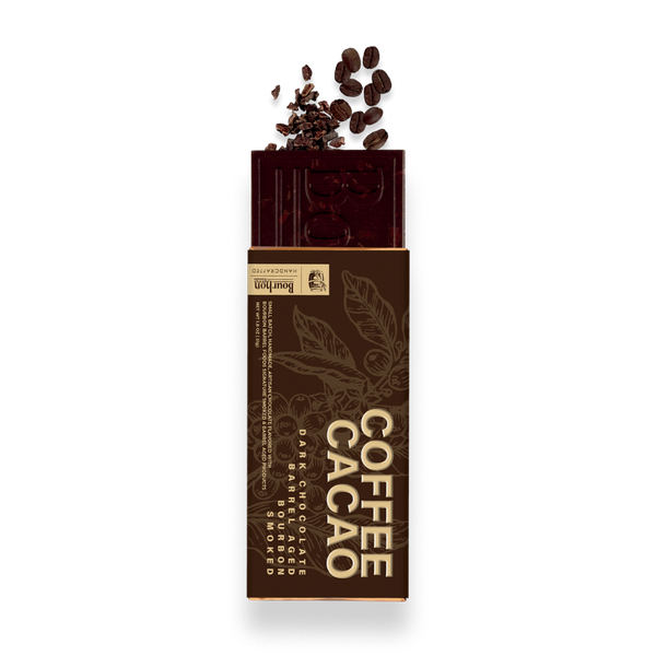 A Barbell Coffee Cacao chocolate bar in its brown paper wrapper, with dark cacao beans and cocoa powder spilling from the top, on a white background.