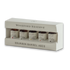 Woodford Reserve Bourbon Barrel Aged bitters set in a white presentation box, containing four small bottles with dark bitters visible through clear windows.