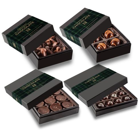 Four chocolate gift boxes arranged in a grid on a white background. Two boxes are closed with dark green plaid lids and gold 'CHOCOLATE' text, and two are open, showing assorted chocolates inside: one with dark chocolate truffles and one with round milk chocolate pieces.