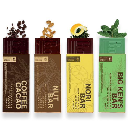 Four packaged chocolate bars arranged side by side on a white background: Coffee Cacao, Nut Bar, Nori Bar, and Big Ken's Bar. Each bar is shown with its branded wrapper and decorative ingredient splashes above the package.