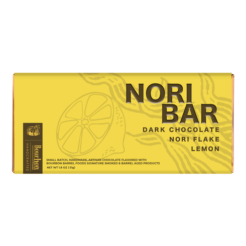 A yellow rectangular box of Berry Baes Dark Chocolate Nori Flake Lemon bars, featuring black text and a lemon illustration on a white background.