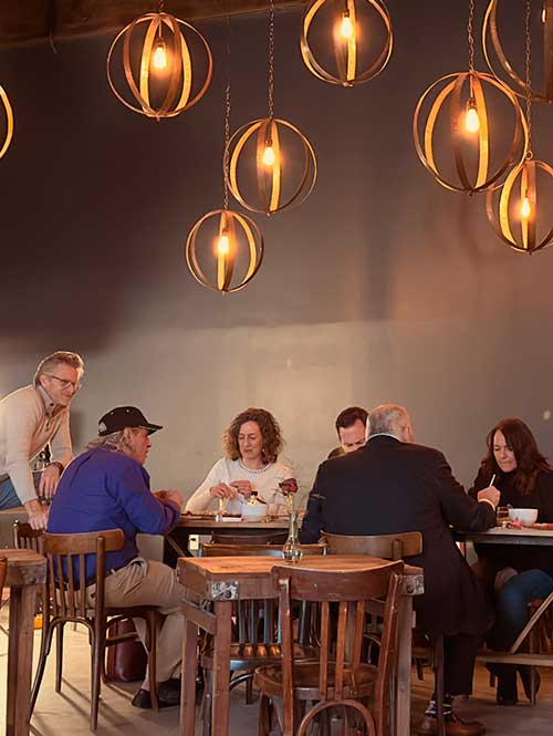A group of people tasting Bourbon Barrel Foods products after a tour
