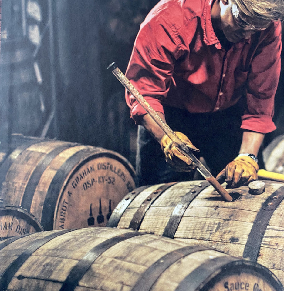 Matt Jamie pulling a sample from a barrel