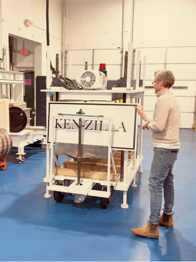 Matt Jamie showing off their soy sauce press, which they named Kenzilla