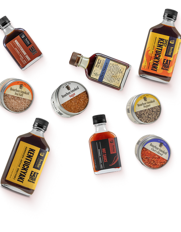 Bourbon Country Bundle: bourbon sauces, smoked salts, and Kentuckyaki bottles on a golden-orange background