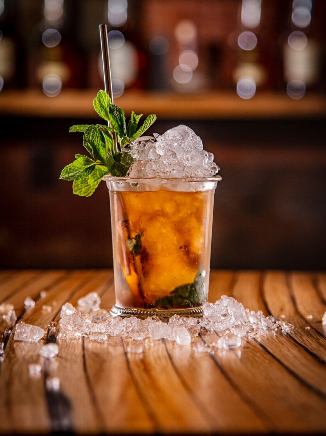 Photo of a mint julep in a clear glass
