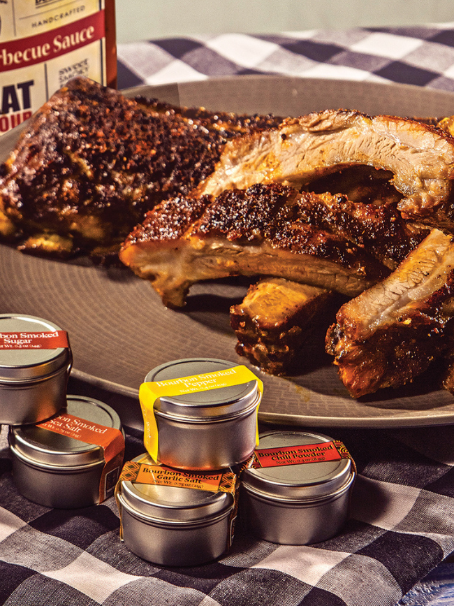 Bourbon Barrel Foods Dry Rub for Ribs and Grilling. shown grilled ribs perfectly cooked with Bourbon Barrel Foods Barbecue Sauce.
