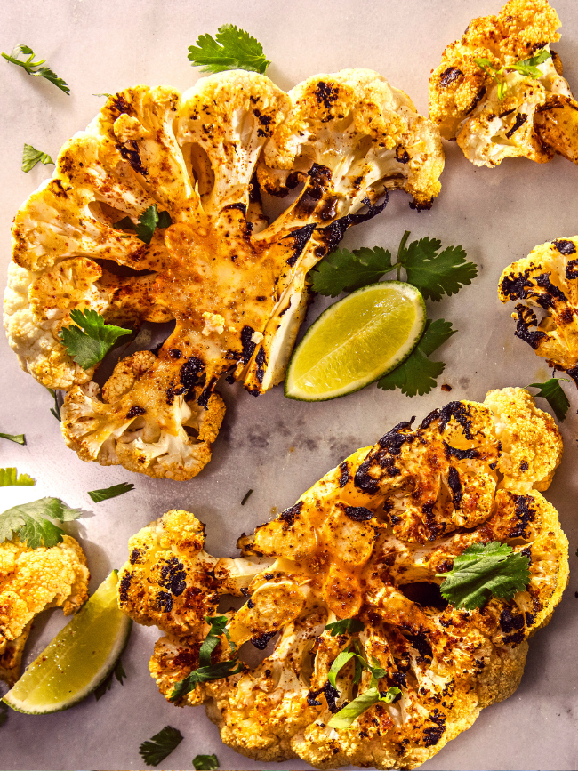 Bourbon Barrel Foods Chili Lime Cauliflower Recipe - Cauliflower Steaks- Made with Bourbon Smoked Spices and Bourbon Barrel Aged Sauce - delicious grilled or roasted. Eat Your Bourbon.