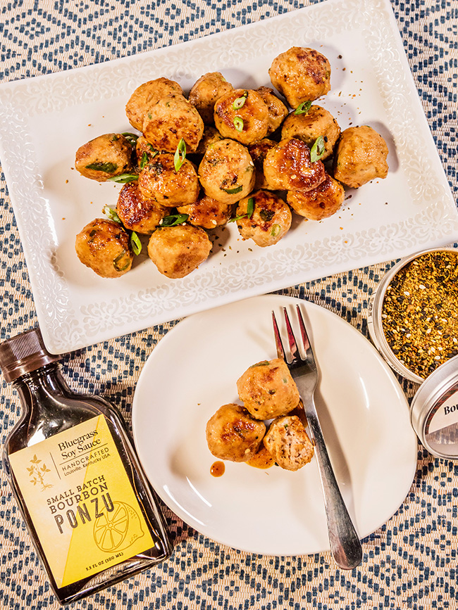 Overhead photo of ponzu togarashi meatballs with seasoning and ponzu sauce