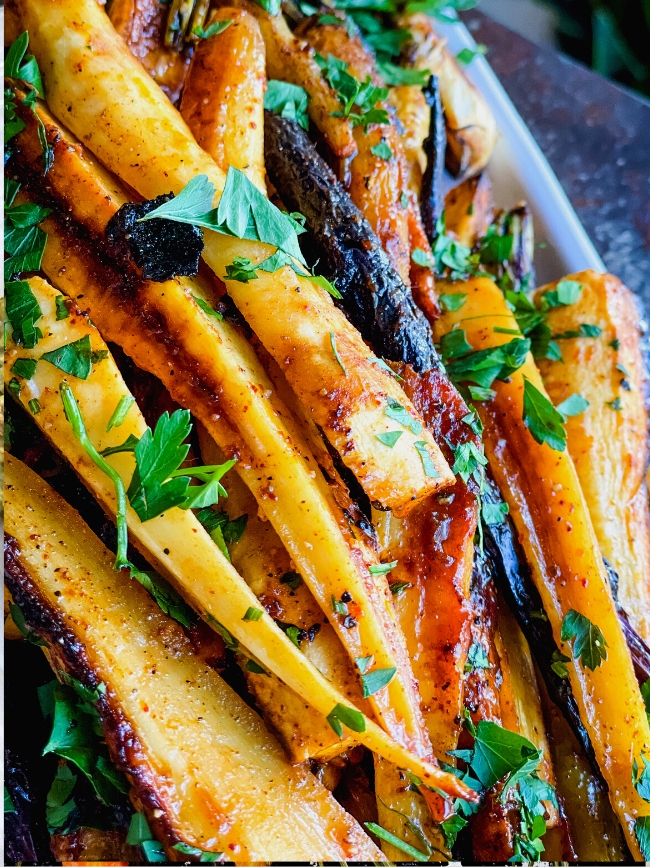 Bourbon Barrel Foods Bourbon Smoked Curry Roasted Carrots on a serving platter. Ready to Eat. Eat Your Bourbon