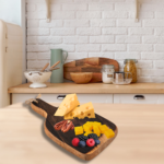Bourbon Barrel Foods - Bourbon Barrel cutting board or charcuterie board, in the shape of an Woodford Reserve Bourbon bottle. Shown with a cheese spread in a beautiful kitchen.